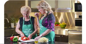 Our story, Susan and Francis cutting vegetables image