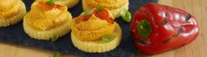 roasted red pepper hummus on a cracker beauty image