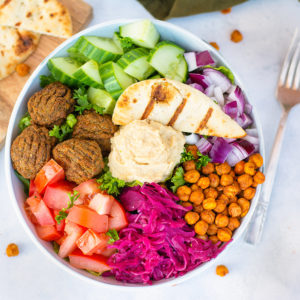 Shawarma Buddha bowl with assortment of toppings, hummus and falafel