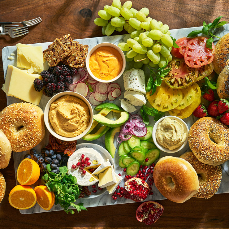 spread of bagels, fruits and vegetables beauty image