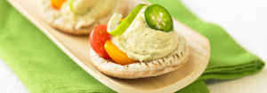Jalapeño Edamame hummus on a pita bread product beauty image